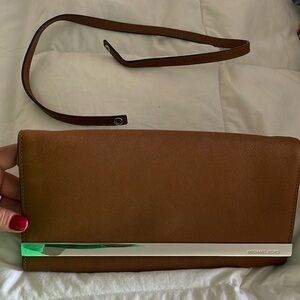 Michael Kors leather cognac colored clutch with removable strap